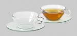 Glasteetasse mit Untersetzer